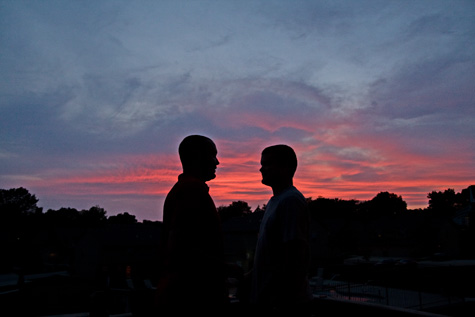 boys talking at sunset