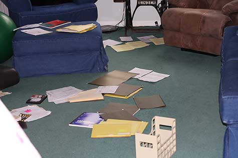 papers spread out in family room