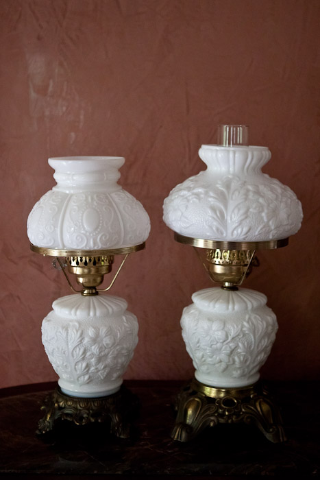 two milk glass lamps