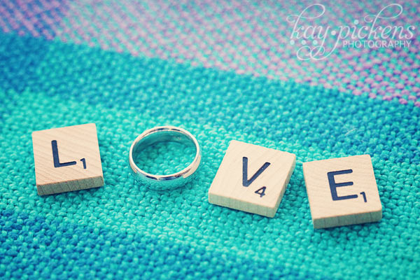 Love out of scrabble tiles and wedding ring